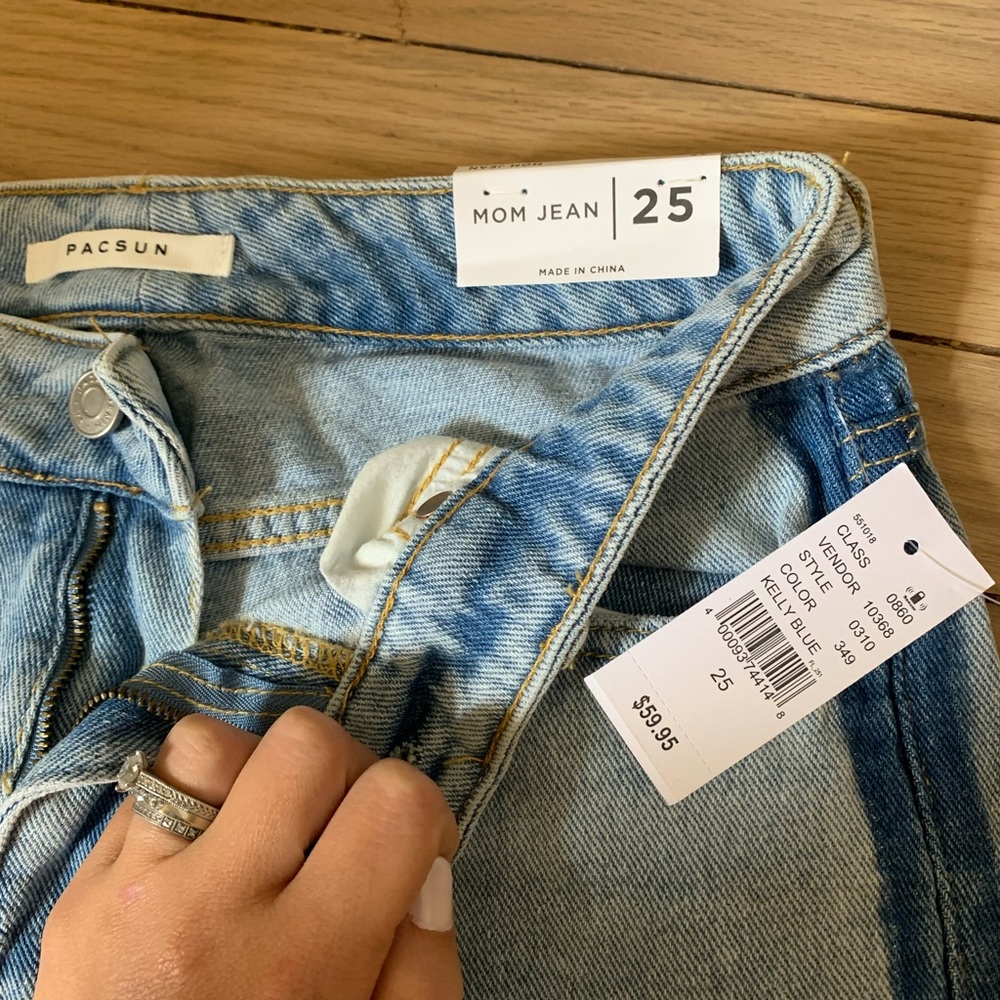 Brand new jeans with stripe along side